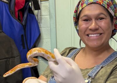 woman holding corn snake